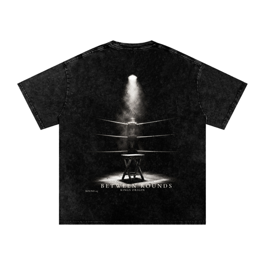 Front mockup: Kings Origin Between Rounds snow washed heavyweight tee, KO center chest print, black, front view
Back mockup: Kings Origin Between Rounds tee, cinematic boxing corner graphic, empty stool under single light, between rounds text, back view
Lifestyle shot (when you have it): Kings Origin Between Rounds heavyweight tee worn in training environment