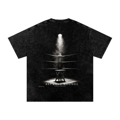 Front mockup: Kings Origin Between Rounds snow washed heavyweight tee, KO center chest print, black, front view
Back mockup: Kings Origin Between Rounds tee, cinematic boxing corner graphic, empty stool under single light, between rounds text, back view
Lifestyle shot (when you have it): Kings Origin Between Rounds heavyweight tee worn in training environment